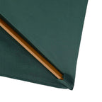 Green garden parasol canopy corner with wooden support rib and stitched edge