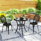 Black three-piece bistro set with round table and two scroll-back chairs on patio