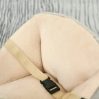 Grey plush seat cushion with beige safety belt and black buckle