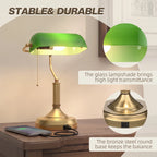 Green glass shade banker desk lamp with bronze base and pull-cord switch