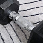 Close-up of black hex rubber dumbbell head and knurled steel grip handle