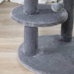 Grey plush round platform cat tree with central post and adjacent perch
