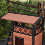 Outdoor cat house with sloped roof and balcony railing; brown wood front door