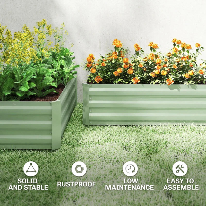 Set of two light green steel raised planter boxes with flowering plants
