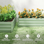 Set of two light green steel raised planter boxes with flowering plants