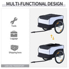 Black-and-white bike cargo trailer with cover and hitch; diagram shows tools and luggage use