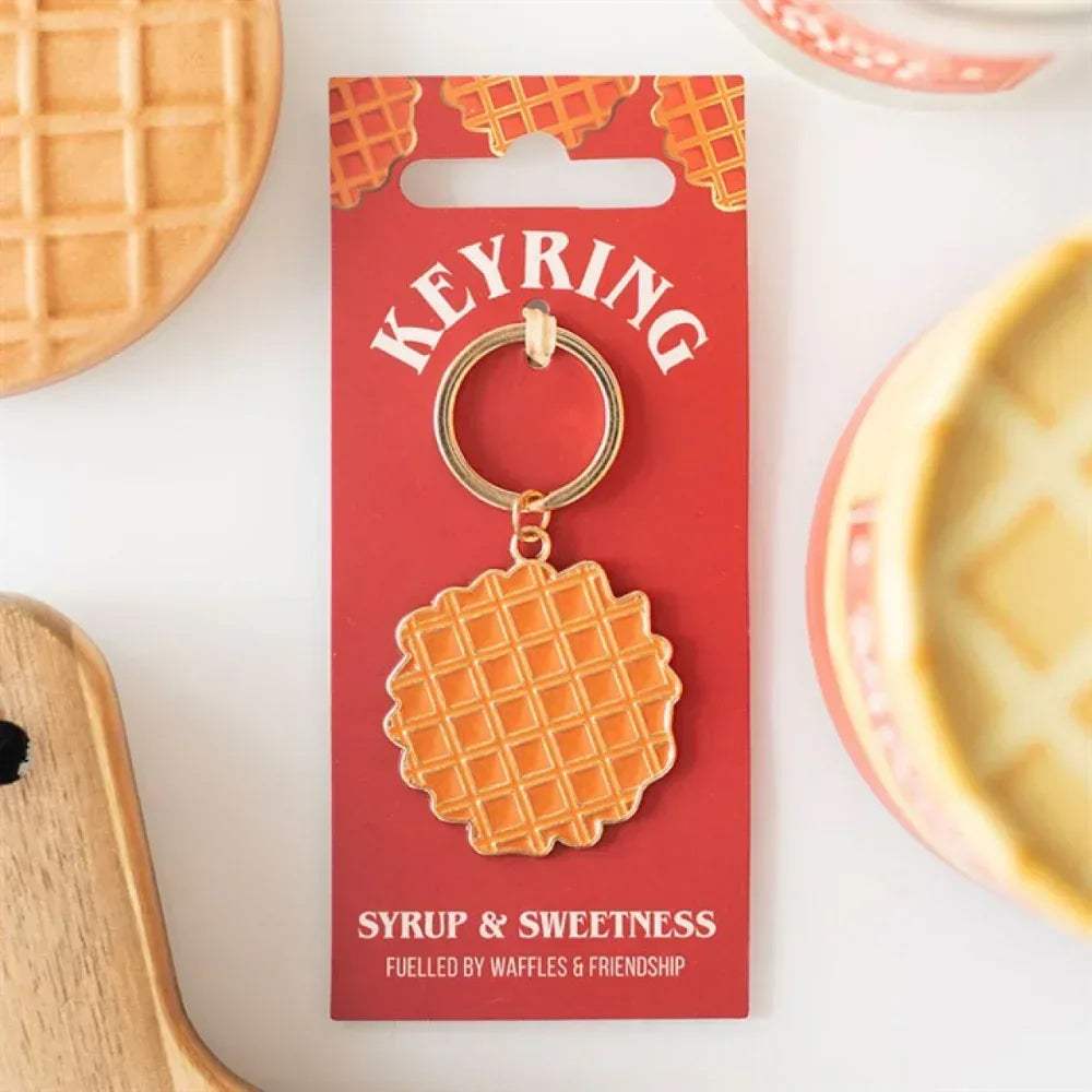 Waffle keyring with orange waffle charm and metal ring, on retail card