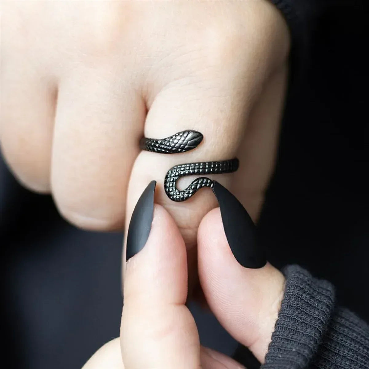Black textured snake adjustable ring with curved head detail