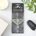 Moth-shaped air freshener in Dark-Forest Moth package with apple scent label