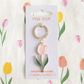 Enamel tulip keyring with gold ring, pink tulip charm, and green leaf accents