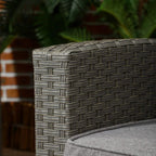 Grey woven rattan armrest detail with corner texture and padded cushion edge