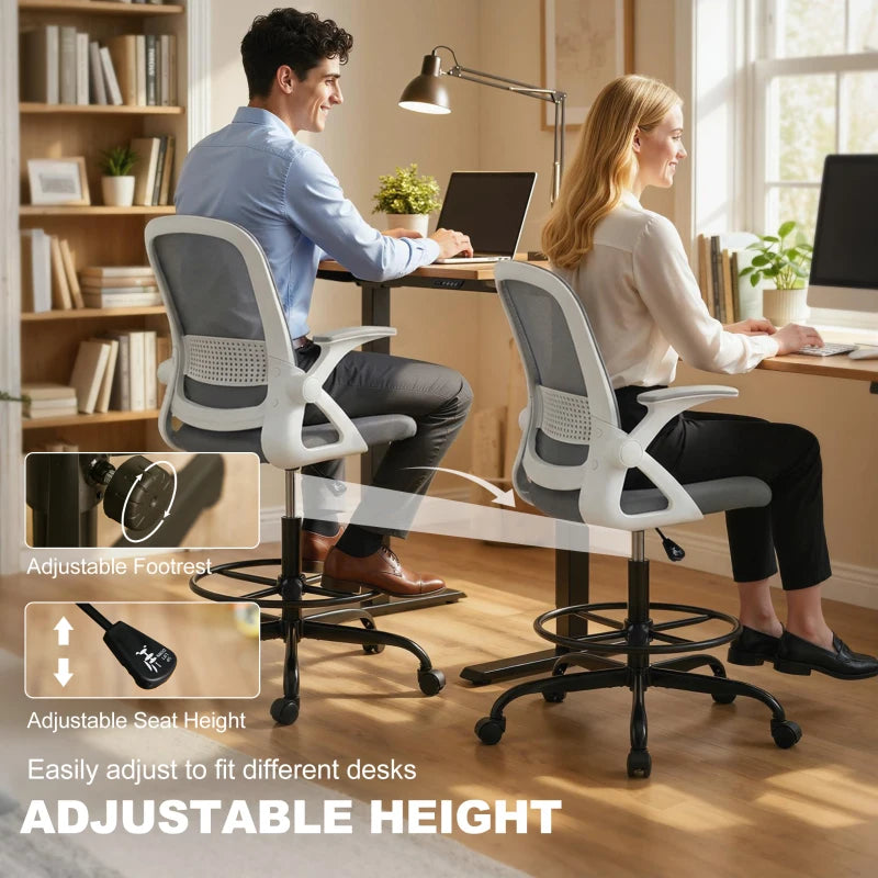 Grey mesh desk chair with flip-up armrests, adjustable seat height, in use.