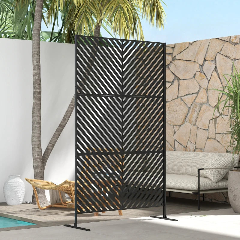 Black metal outdoor privacy divider with triangle pattern on freestanding stand, side view