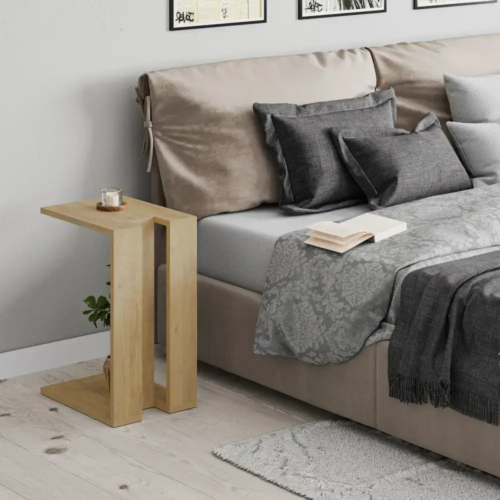 Oak C-shaped side table with top and lower open shelves for everyday use