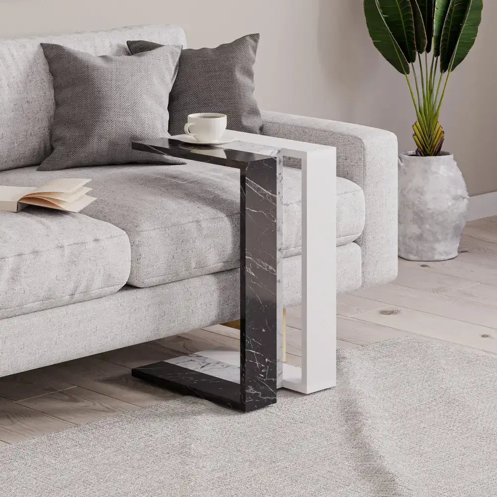 White and black C-shape side table with marble-look panel and open design