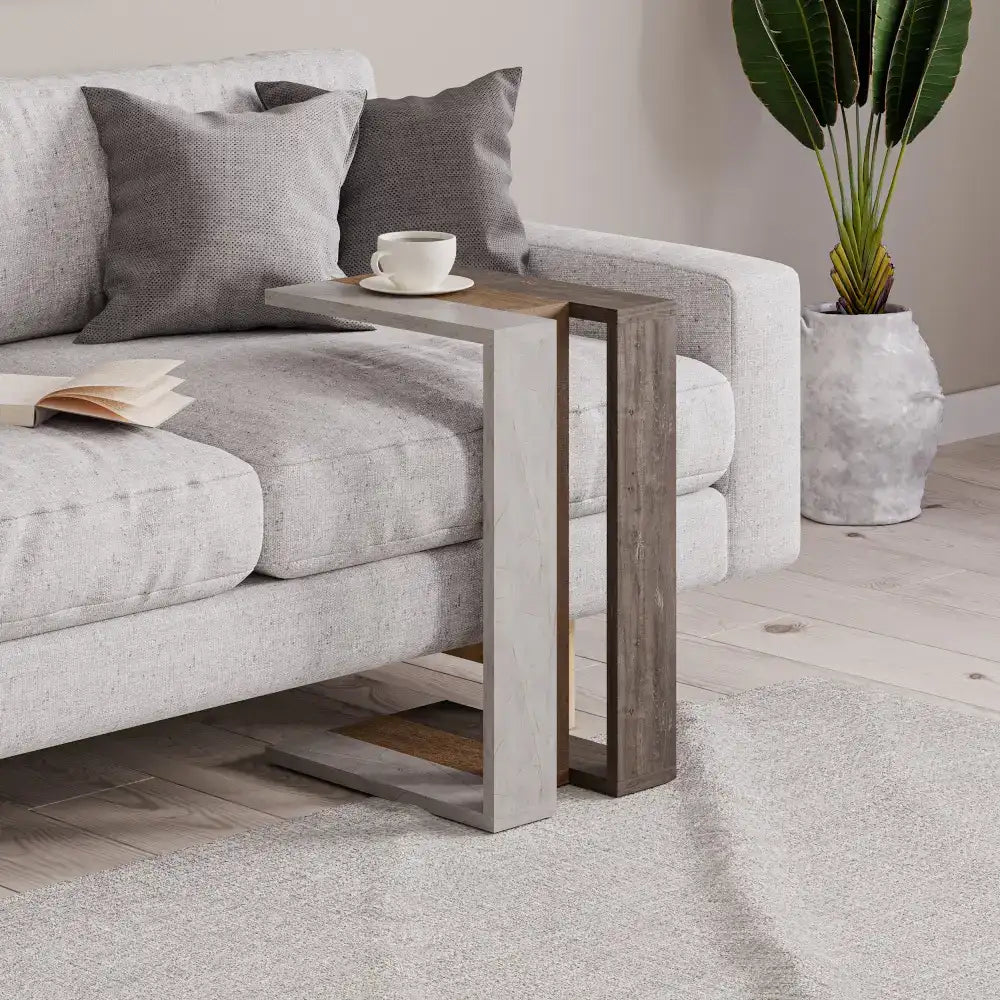 Two-tone C-shaped side table with light wood frame and dark top shelf