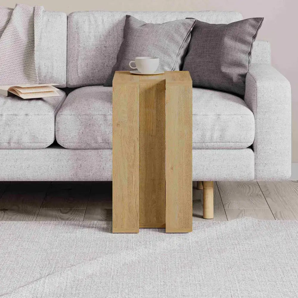 Light oak C-shaped side table with stacked open shelves and square legs