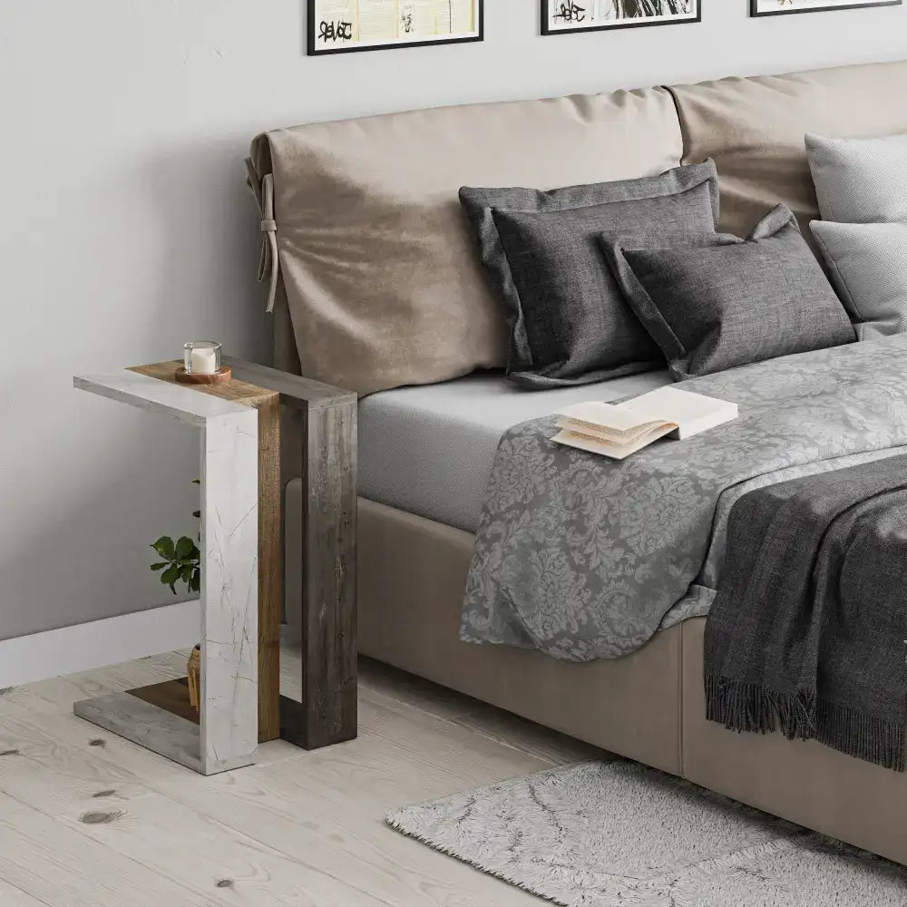 C-shaped side table with light frame and dark marble-look top, multipurpose side table