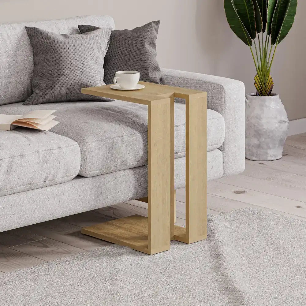 Two-tone C-shaped side table with light wood finish and dark top surface