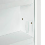 White glass door side detail with handle and mounting hardware on cabinet