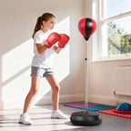 Free-standing boxing set with red boxing ball and red gloves on adjustable stand