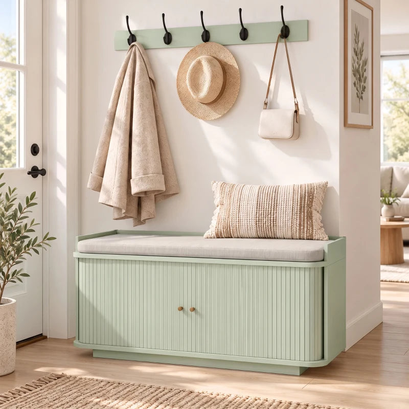 Light green hallway storage bench with cushioned lid and wall coat hooks