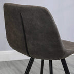 Dark grey padded bar stool backrest with diamond-quilted pattern and curved profile