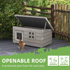 Grey wooden cat house with openable roof, two front windows, and asphalt roof