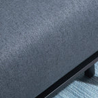 Dark grey woven upholstery fabric with black metal support along the chair base