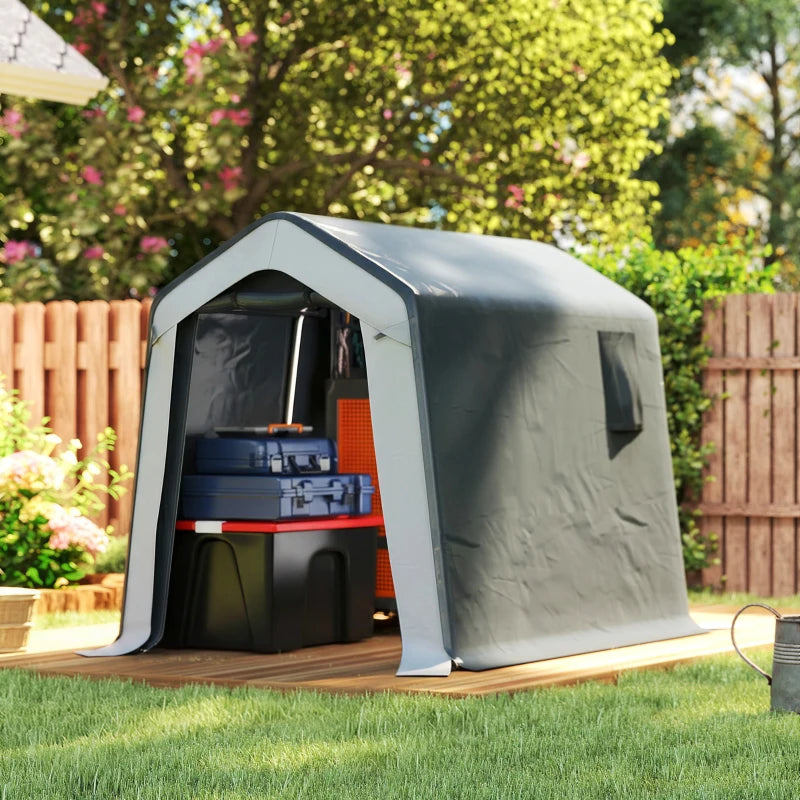 Grey storage shed tent with open front and stored tools on outdoor base