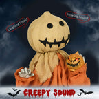 Halloween scarecrow decoration doll with stitched grin face and glowing jack-o-lantern
