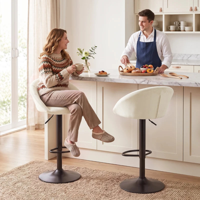 Cream upholstered counter stool with curved back and black round pedestal base