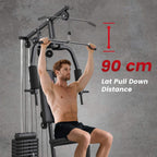 Lat pulldown station on black home gym machine with padded seat and 90 cm distance