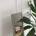 Wall-mounted full-length mirror with grey frame and mounted hanging points
