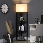 Lit tall corner floor lamp with black frame, beige fabric shade, and built-in shelves