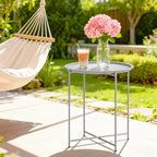 White round outdoor table with removable tray top and sturdy four-leg metal stand