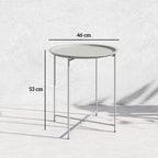 White round side table with removable tray and four folding legs, white metal frame