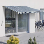 Retractable awning with dark blue and white striped canopy and scalloped valance