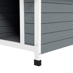 Grey wooden dog kennel side panel and front leg with black foot pad