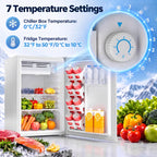 Mini fridge interior with chiller box and thermostat dial, with stocked shelves