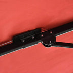 Wine red umbrella canopy arm joint with release hardware and securing strap