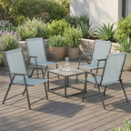 Set of 4 light grey high-back folding chairs with armrests and black frames on outdoor deck