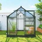Grey polycarbonate greenhouse with sliding door and end window, side angle