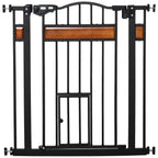 Black pet safety gate with cat flap and auto-close latch, front view with vertical bars