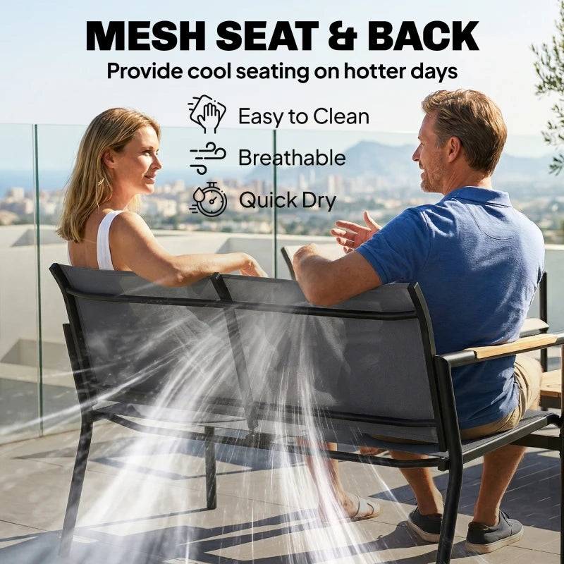 Grey mesh seat and back armchairs from a metal outdoor patio furniture set
