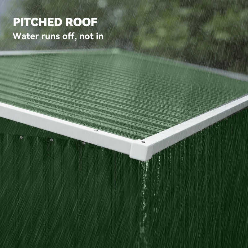 Green metal shed corner with pitched roof edge and water-shedding trim
