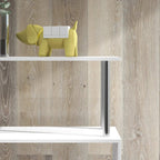 White bookcase top shelf edge with chrome-like metal support leg