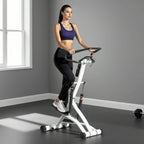 Stair stepper workout machine with console and wide non-slip foot pedals, in use.