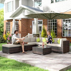 Brown rattan corner sofa set with white seat cushions, lime pillows, and glass-top coffee table