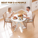 White round dining table with tripod base for small meals and drinks